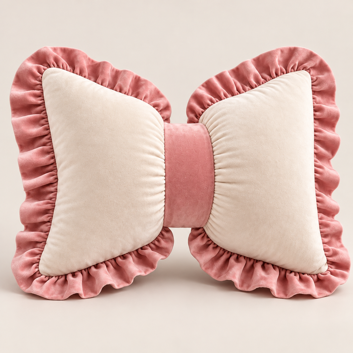 Ivory and blush-pink velvet ruffle bow cushion, 18 by 15 inches