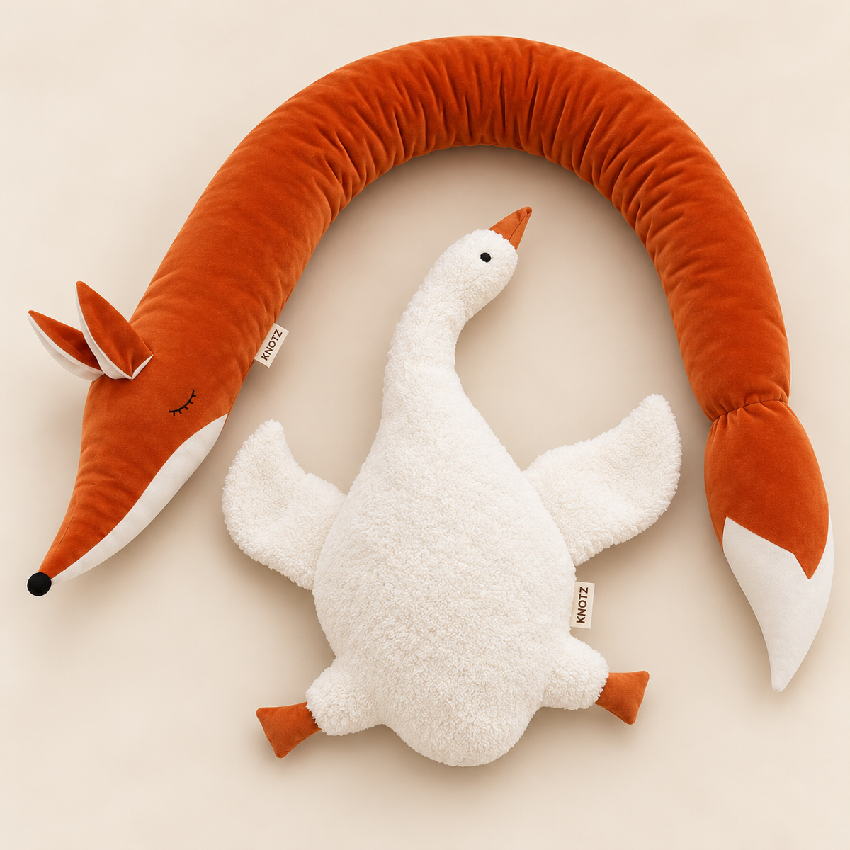 KNOTZ rust velvet fox bolster and ivory terry goose shaped cushion duo