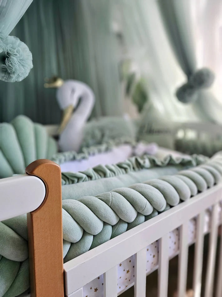Mint green baby crib bedding with braided crib bumper