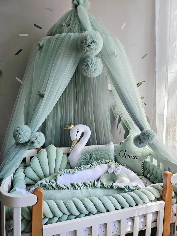 Mint green baby crib bedding with braided crib bumper